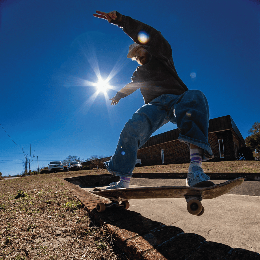 skateboarder grinding in SOCCO Naturals Lilac Stripes