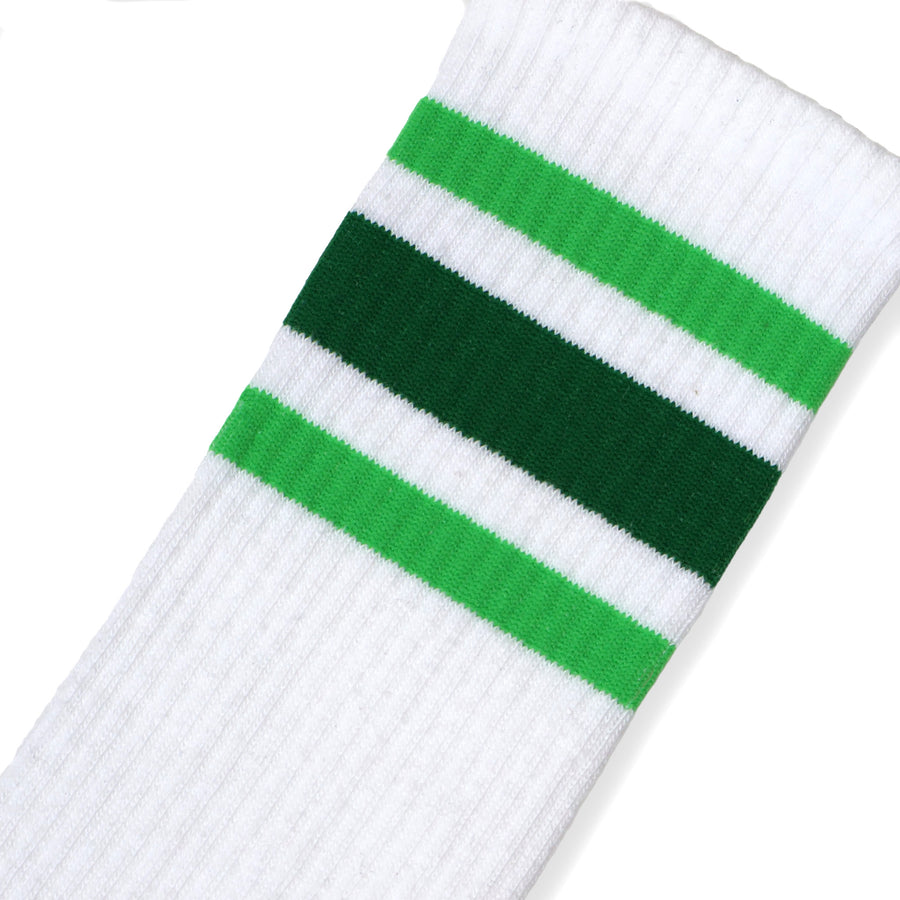 A Close up, angled photo with a Light Green, Dark Green, and Light Green set of three stripes on a White Classic Knee High Length Sock.