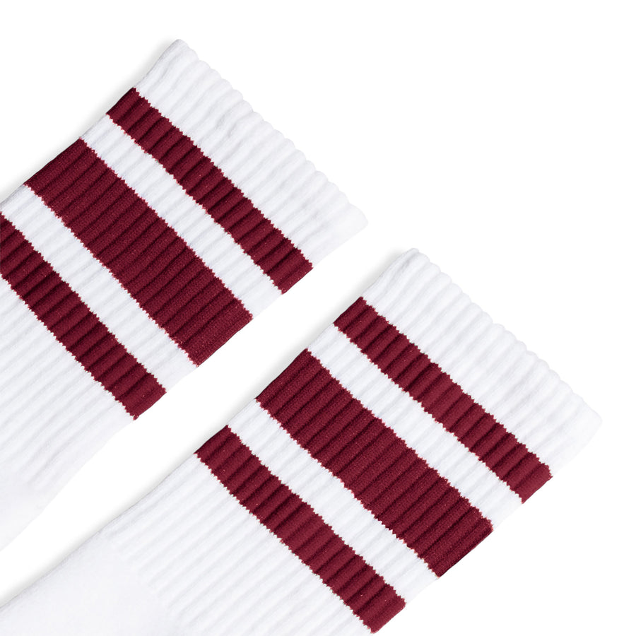 White athletic crew length socks with three maroon stripes for men, women and kids.