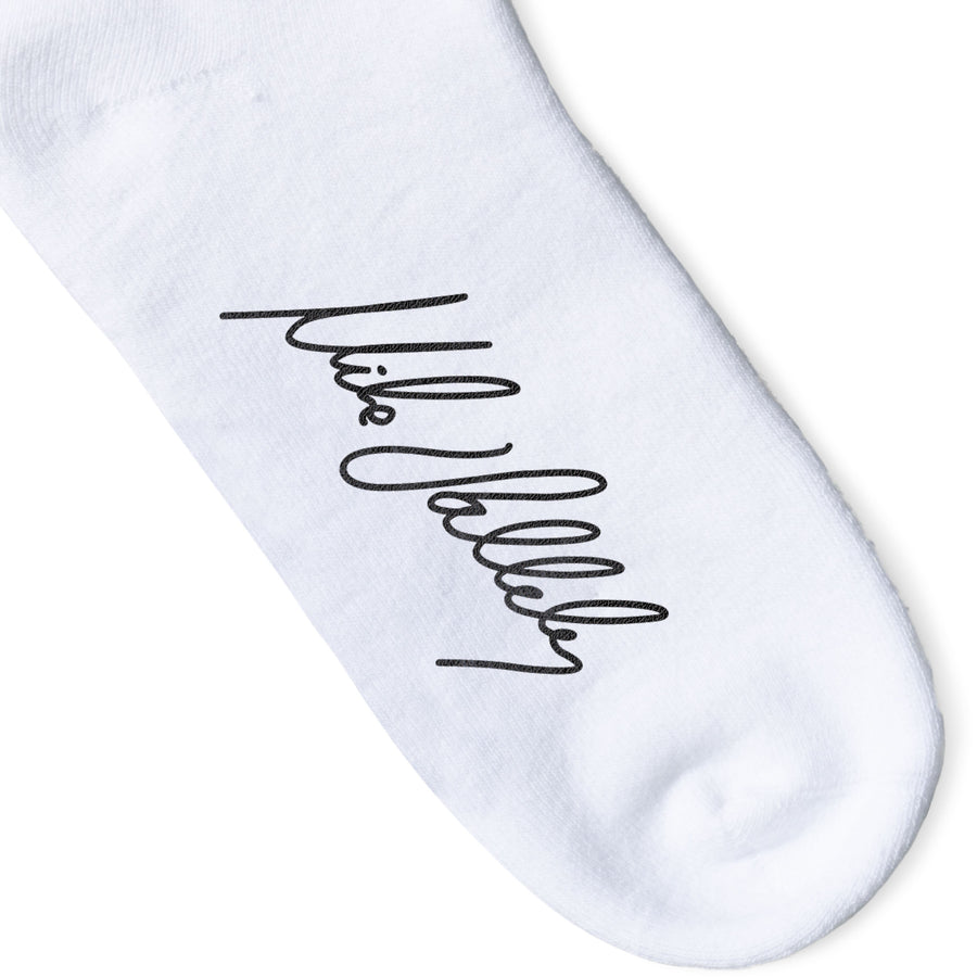 White Crew socks with Large Black Lightning Bolts decorating the leg all the way around in between two thin red stripes. Mike Vallely's Signature knitted into the bottom of the foot.