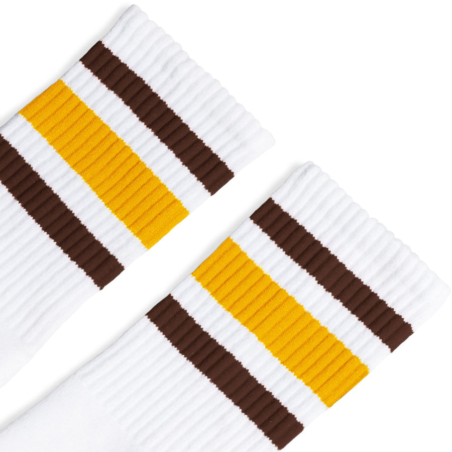 White athletic socks with 3 stripes on the leg in brown, gold, and brown. For men, women and kids. Crew Sock Length.