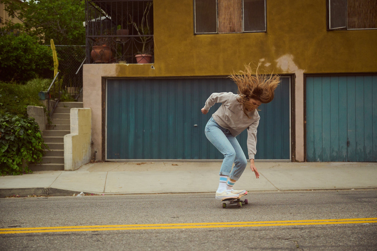 Skateboarder Sierra Prescott skating down the street in California.