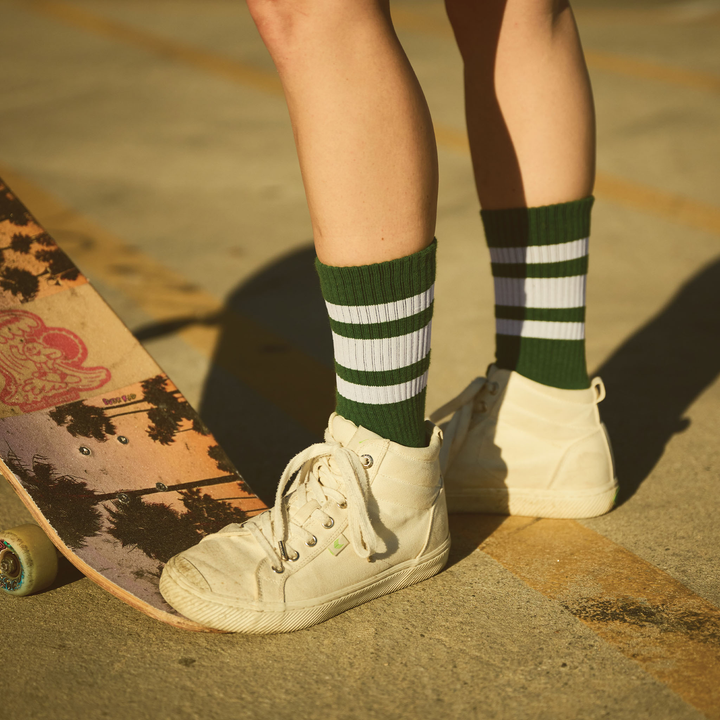 Sierra Prescott wearing Squad colors SOCCO socks while skateboarding.