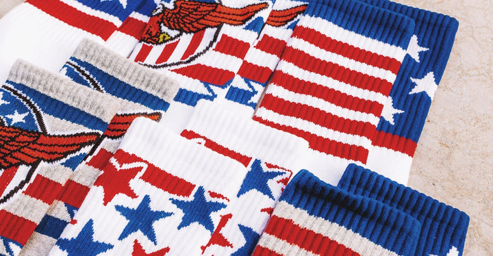 Multiple pairs of red, white and blue July 4th style SOCCO socks.