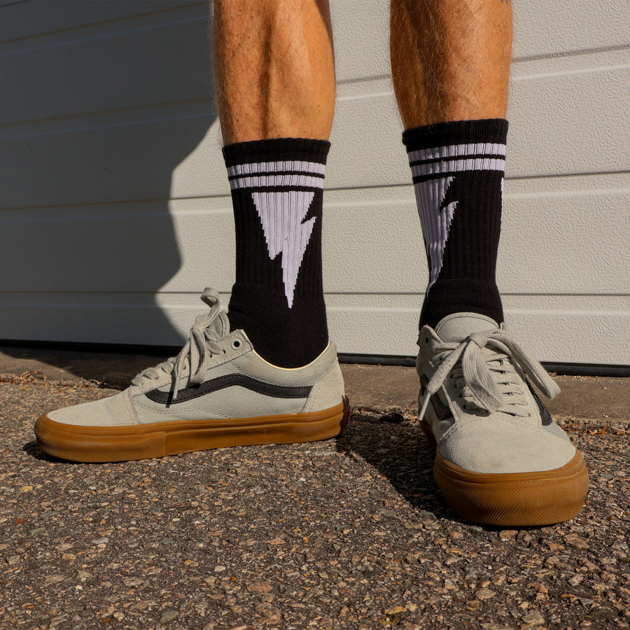 Mike Vallely Signature Sock in Black with white lightning bolts and two stripes.