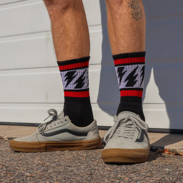 Mike Vallely Signature Socks in Black with red stripes and lightning bolts.