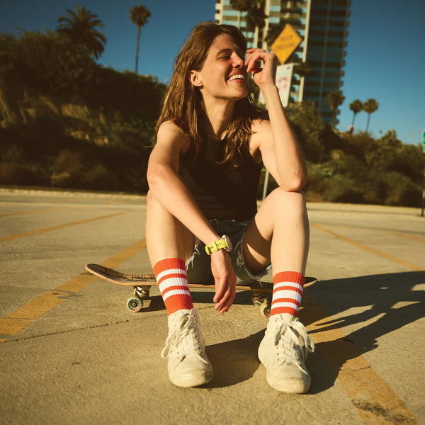 Red SOCCO socks with white stripes