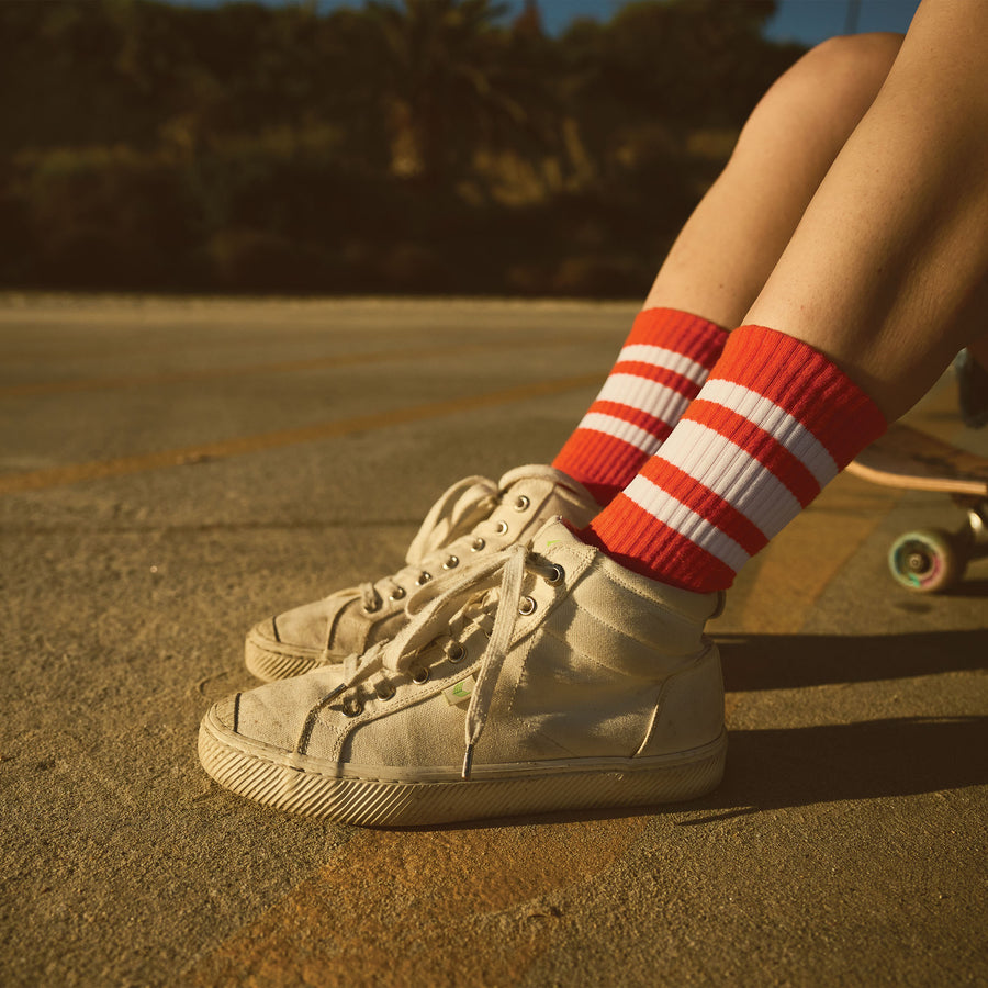Red SOCCO socks with white stripes