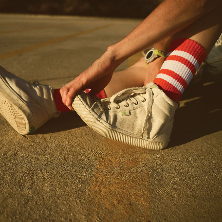 Red SOCCO socks with white stripes