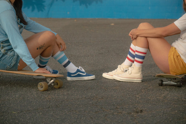 Female wearing red, white, and blue All American SOCCO socks