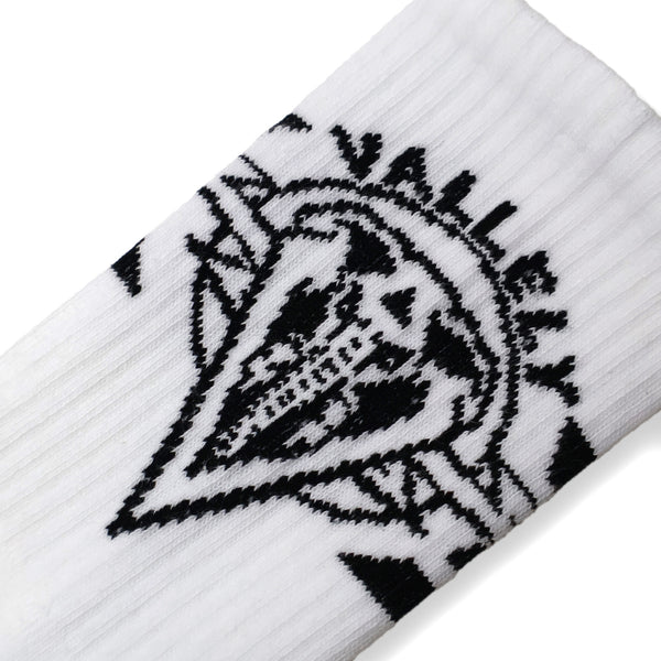 Dirty Donny x Mike Vallely Collaboration Crew Socks. White Crew Socks with 3 black stripes on the leg. Mike Vallely's Elephant V Logo with lightning bolts in an inverted triangle on the front of the leg. "VALELLY" in all caps above the Mike V Elephant Logo.