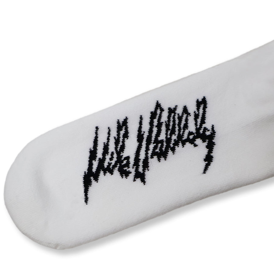 Dirty Donny x Mike Vallely Collaboration Crew Socks. White Crew Socks with 3 black stripes on the leg. Mike Vallely's Elephant V Logo with lightning bolts in an inverted triangle on the front of the leg. 