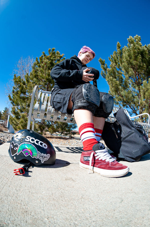 Red SOCCO socks with white stripes