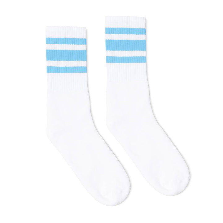 White athletic socks with three Carolina blue stripes. Crew Length Socks for men, women and kids.