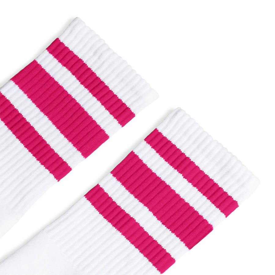 White athletic socks with three fuchsia stripes. Crew Length socks for men, women and children.