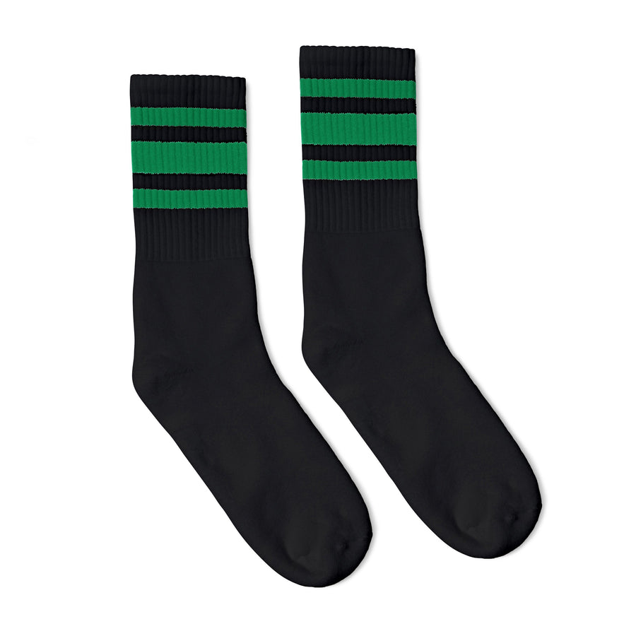 Black athletic crew length socks with three green stripes for men, women and children.