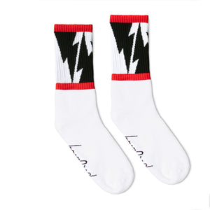 White Crew socks with Large Black Lightning Bolts decorating the leg all the way around in between two thin red stripes. Mike Vallely's Signature knitted into the bottom of the foot.