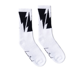 White Crew socks with Large Black Lightning Bolts decorating the leg all the way around. Mike Vallely's Signature knitted into the bottom of the foot.