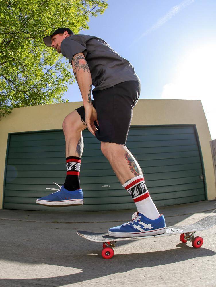 Mike Vallely Signature Sock in white with red stripes and lightning bolts.