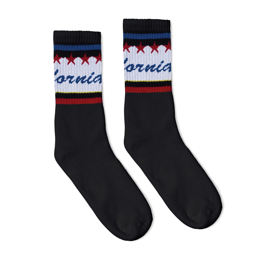 Black athletic socks with California text in blue cursive over white and red and blue stripes.
