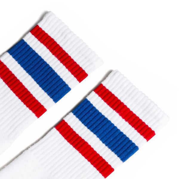 White Crew Sock with a Red Stripe, Blue Stripe, Red Stripe Pattern on the leg.