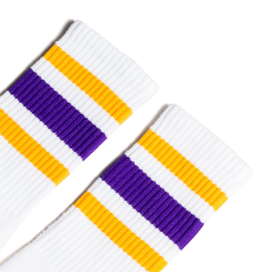 White athletic Crew Length socks with purple and gold stripes for men, women and children.