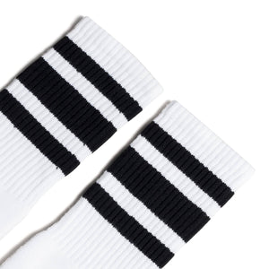 White athletic socks with three black stripes on the Leg. For men, women and kids. Crew Sock Length.