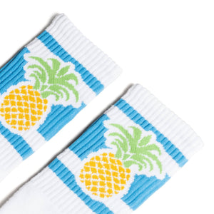 White socks with blue stripes and a pineapple image for men, women and kids.