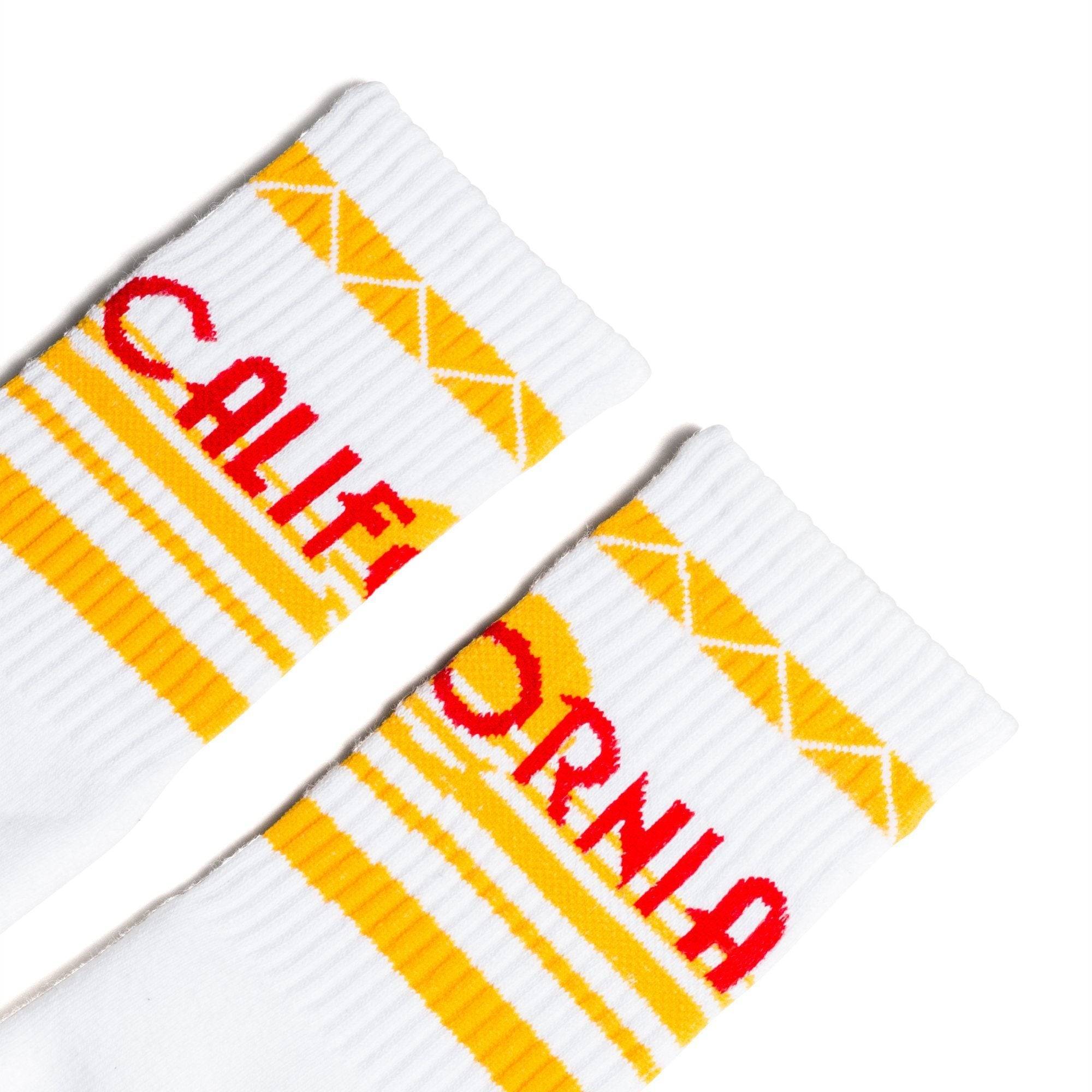 White athletic socks with California text in red and yellow stripes. For men, women and kids.