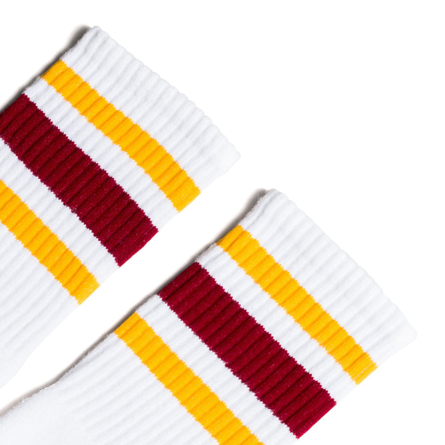 White athletic Crew Length socks with gold and crimson stripes for men, women and children.