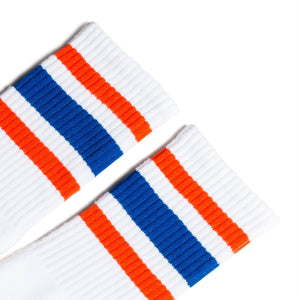 White athletic socks with orange and blue stripes for men, women and kids.