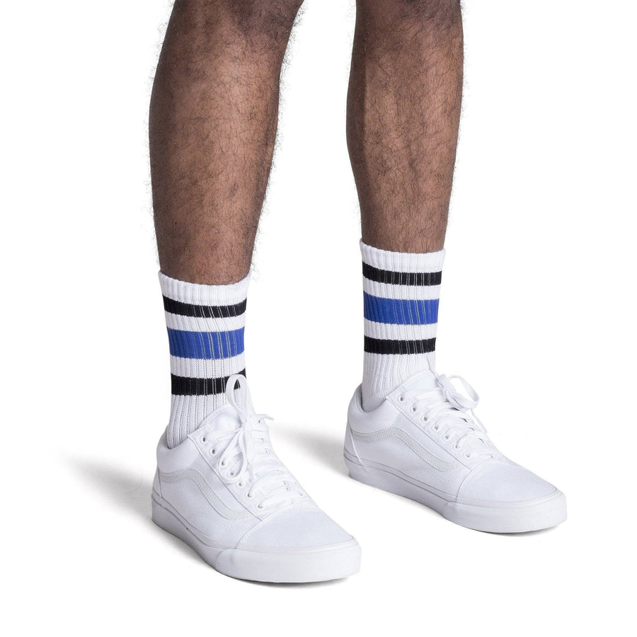 White athletic socks with black and blue stripes for men, women and children.