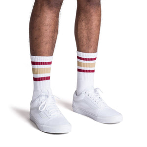 White athletic crew length socks with gold and maroon stripes for men, women and children.