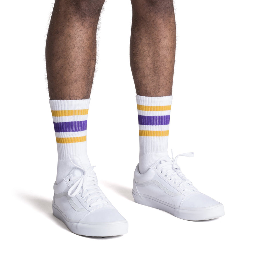 White athletic Crew Length socks with purple and gold stripes for men, women and children.